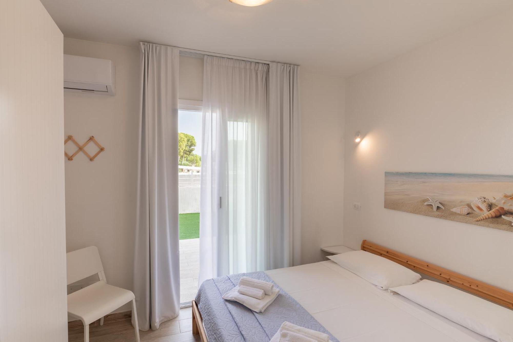 Case Vacanze "Bianco Mare" Porto Pino Cameră foto